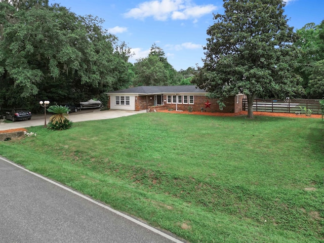 2025 Shadey Oaks Dr, Tallahassee, FL 32303 - ranch-style house featuring driveway and brick siding