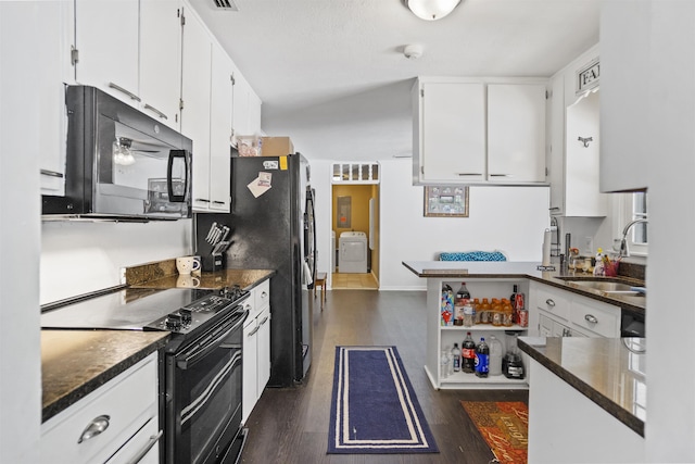 2025 Shadey Oaks Dr, Tallahassee, FL 32303 - kitchen featuring black appliances, washer / dryer, dark wood finished floors, and white cabinets
