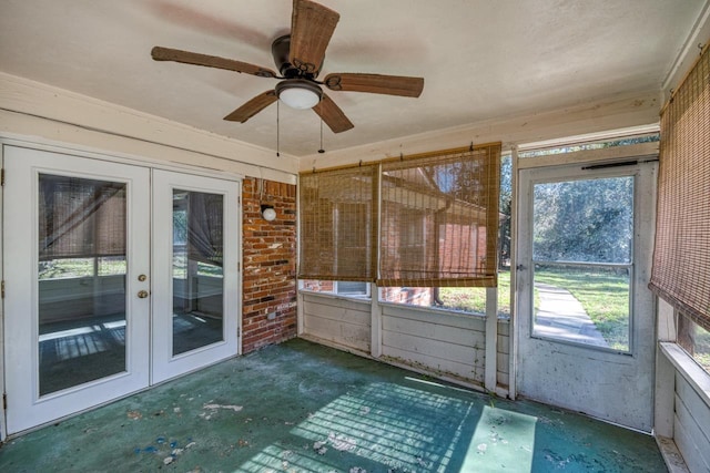 unfurnished sunroom featuring french doors and ceiling fan