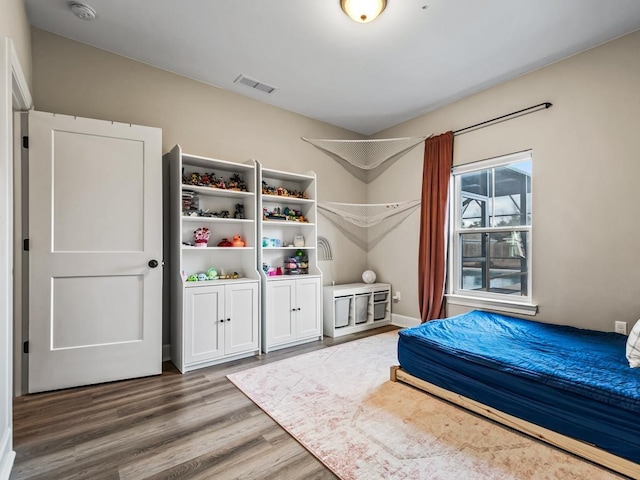 unfurnished bedroom featuring hardwood / wood-style floors