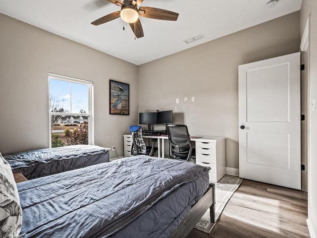 bedroom featuring ceiling fan and light hardwood / wood-style flooring