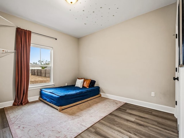 bedroom featuring hardwood / wood-style floors