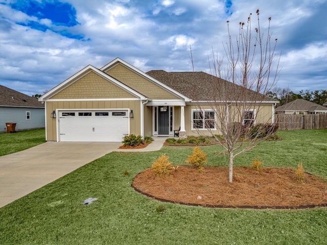 view of front of home featuring a garage and a front lawn