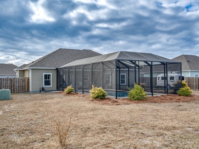 rear view of property with a lanai