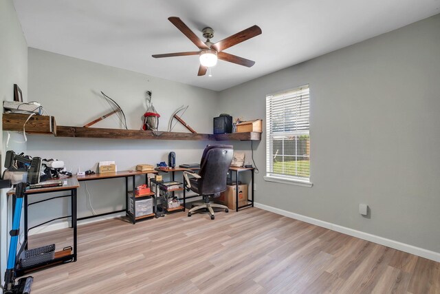 office space featuring ceiling fan, wood finished floors, and baseboards