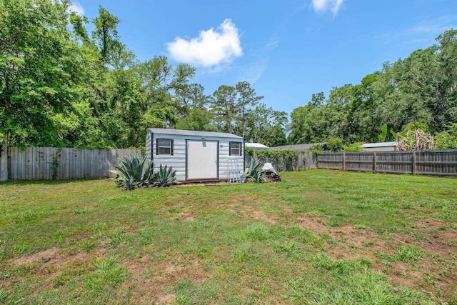 view of yard featuring a shed and an outdoor structure
