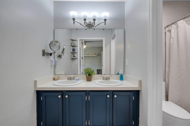 full bath with double vanity, toilet, and curtained shower