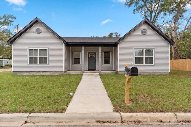 view of front of property with a front lawn