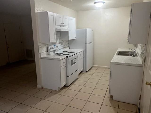 kitchen featuring light countertops, a sink, extractor fan, and white appliances