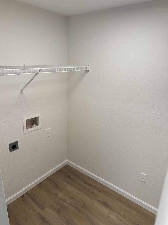 clothes washing area with washer hookup, dark hardwood / wood-style floors, and hookup for an electric dryer