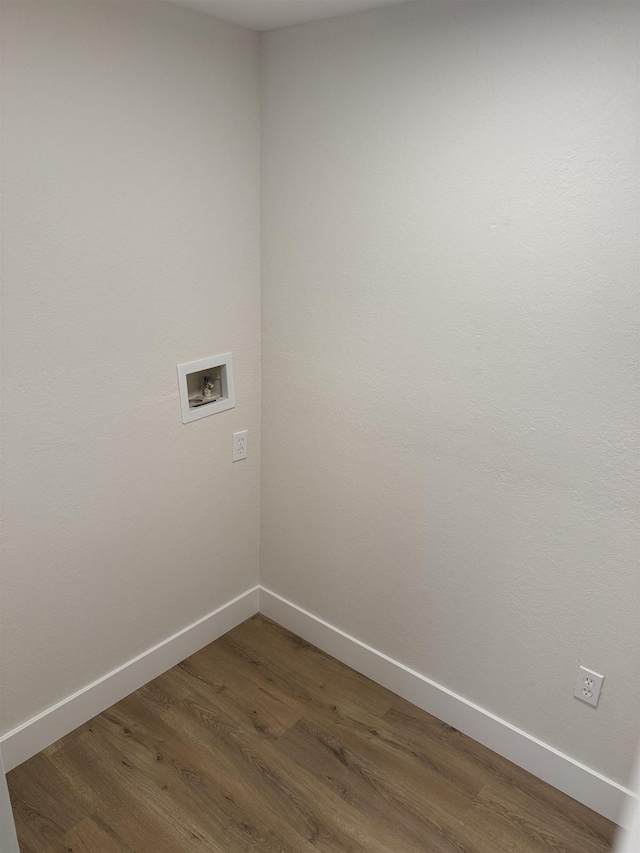 clothes washing area featuring hookup for a washing machine and dark hardwood / wood-style floors