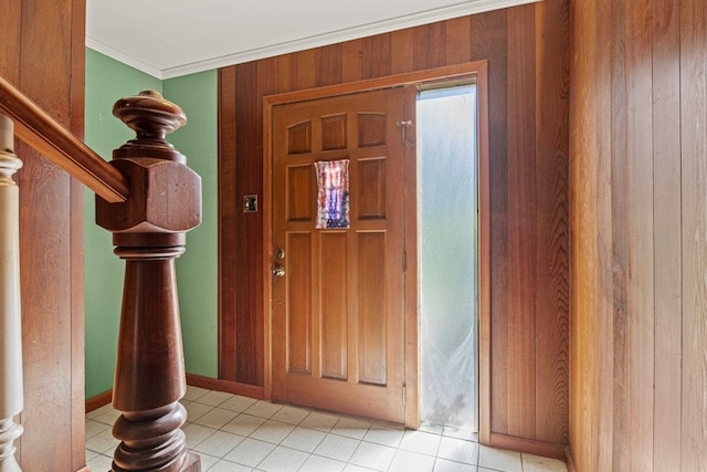 615 N Calhoun St, Quincy, FL 32351 - entrance foyer featuring crown molding, light tile patterned flooring, wood walls, and stairway