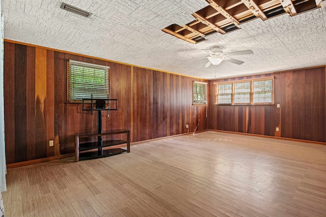 615 N Calhoun St, Quincy, FL 32351 - spare room featuring a ceiling fan, wood walls, an ornate ceiling, and wood finished floors