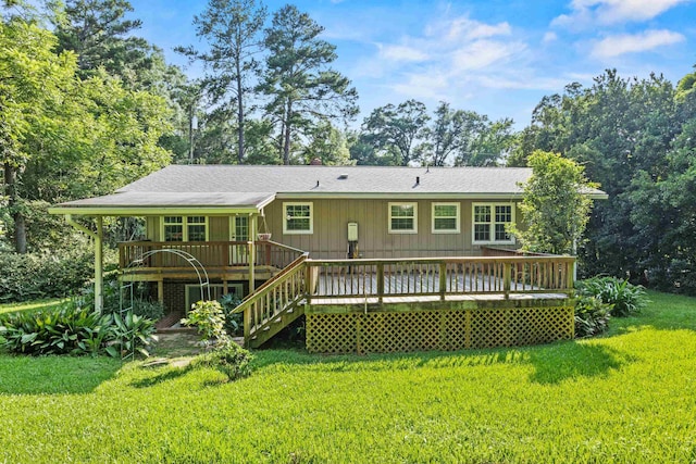 615 N Calhoun St, Quincy, FL 32351 - back of house featuring a yard, a deck, roof with shingles, and stairs