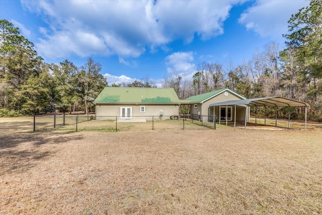 rear view of house featuring a carport