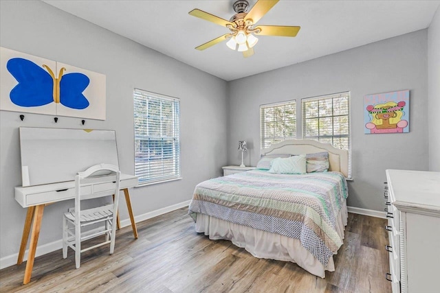 bedroom with hardwood / wood-style flooring and ceiling fan