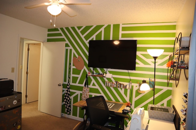 interior space with ceiling fan, carpet, and a textured ceiling