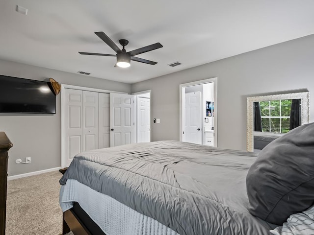 carpeted bedroom featuring ceiling fan and a closet