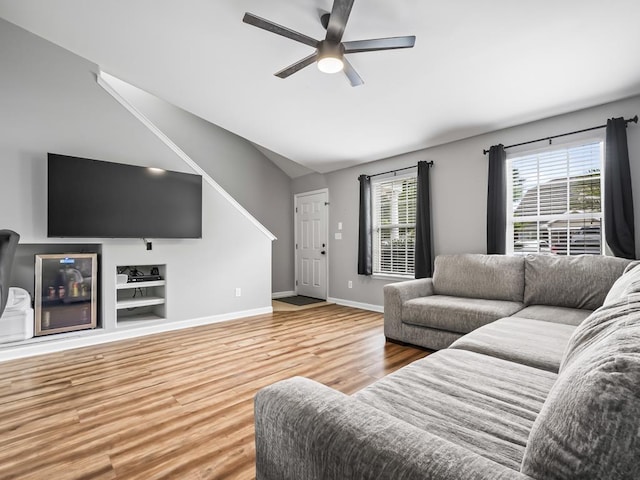 living room featuring plenty of natural light, ceiling fan, and hardwood / wood-style floors