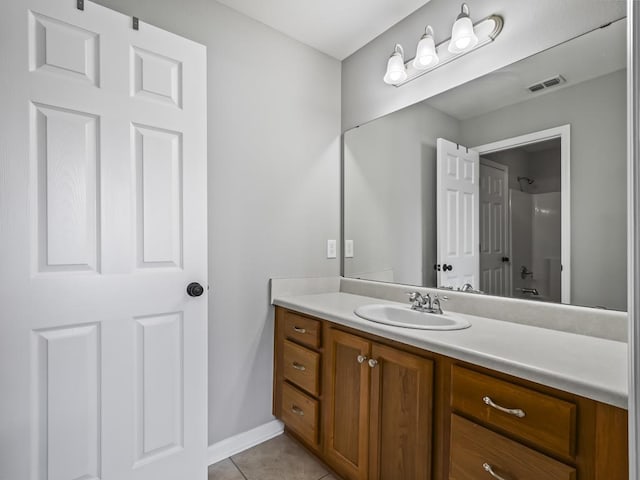 bathroom featuring tile patterned floors and vanity