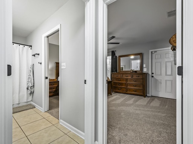 bathroom with tile patterned flooring and ceiling fan