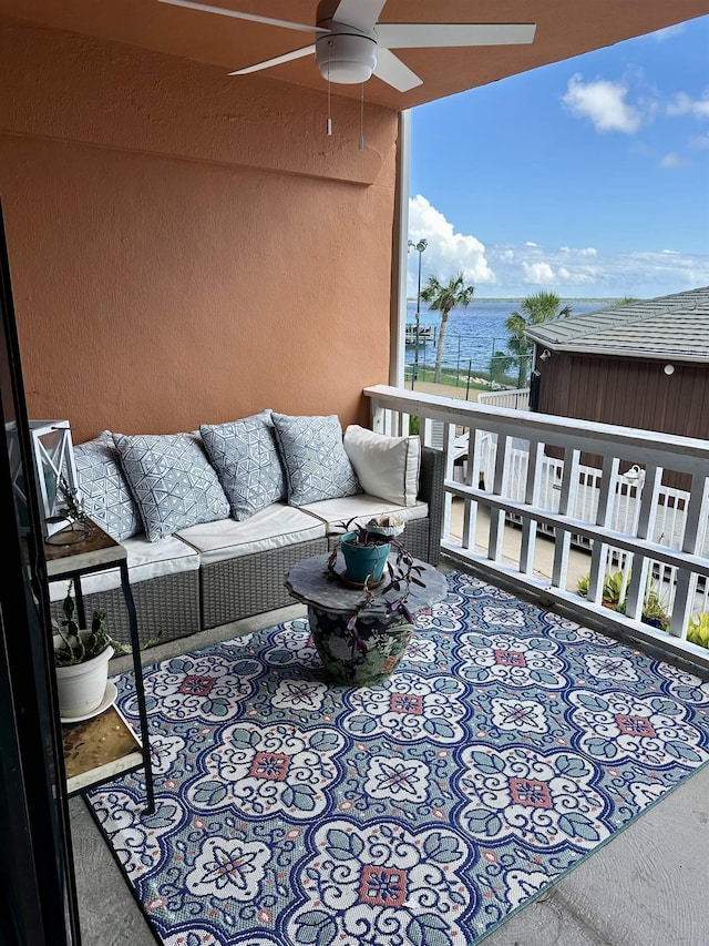 2289 Surf Rd Unit B4, Ochlockonee Bay, FL 32346 - balcony with a ceiling fan, a water view, and outdoor lounge area