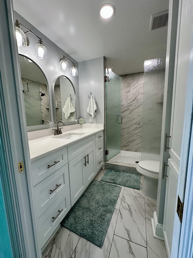 2289 Surf Rd Unit B4, Ochlockonee Bay, FL 32346 - bathroom featuring marble finish floors, a shower stall, vanity, and toilet