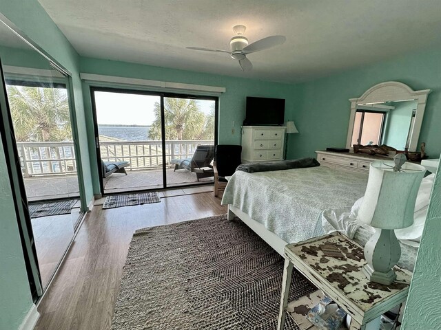 2289 Surf Rd Unit B4, Ochlockonee Bay, FL 32346 - bedroom with wood finished floors, access to outside, and ceiling fan