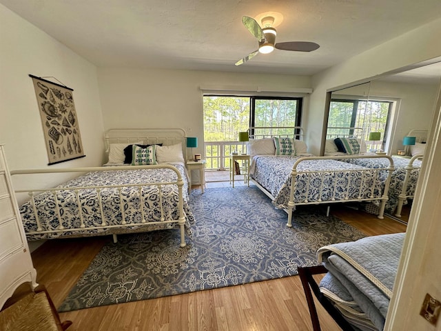 2289 Surf Rd Unit B4, Ochlockonee Bay, FL 32346 - bedroom featuring wood finished floors, access to outside, and ceiling fan