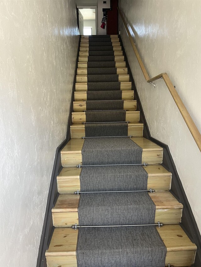2289 Surf Rd Unit B4, Ochlockonee Bay, FL 32346 - stairway featuring a textured wall