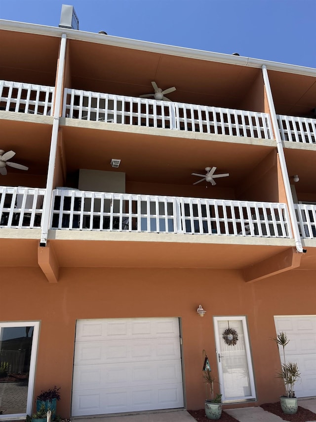 2289 Surf Rd Unit B4, Ochlockonee Bay, FL 32346 - view of building exterior with an attached garage