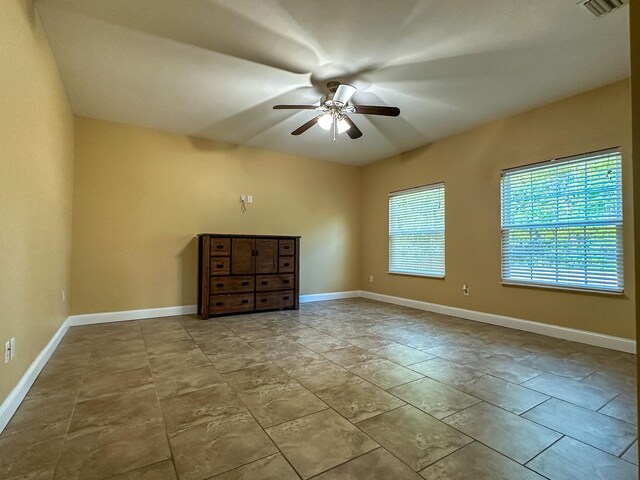 14135 98th St, Live Oak, FL 32060 - spare room featuring ceiling fan and baseboards