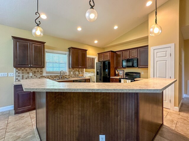 14135 98th St, Live Oak, FL 32060 - kitchen with black appliances, a sink, light countertops, vaulted ceiling, and dark brown cabinetry