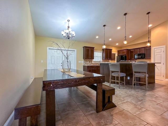 14135 98th St, Live Oak, FL 32060 - dining area with a chandelier, recessed lighting, baseboards, and vaulted ceiling