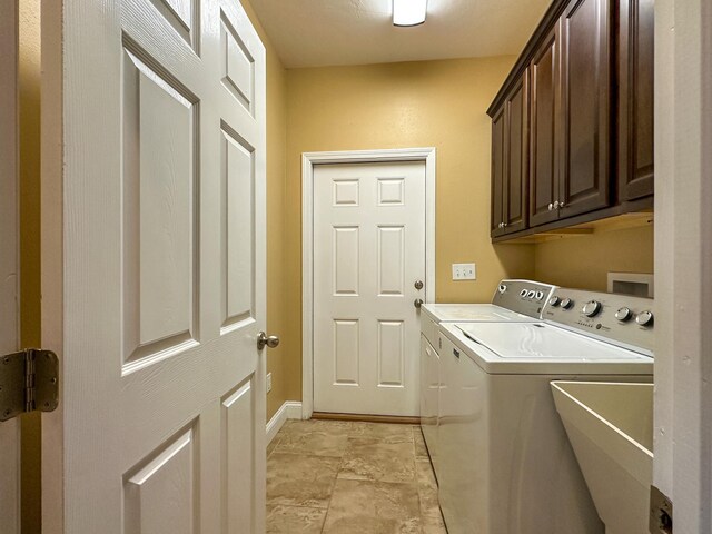 14135 98th St, Live Oak, FL 32060 - laundry room with cabinet space, washing machine and dryer, and baseboards