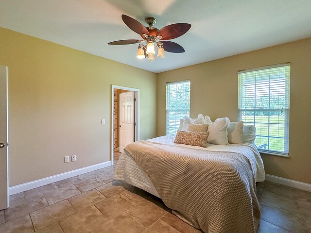 14135 98th St, Live Oak, FL 32060 - bedroom with baseboards and a ceiling fan