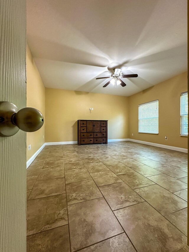 14135 98th St, Live Oak, FL 32060 - unfurnished living room with a ceiling fan and baseboards