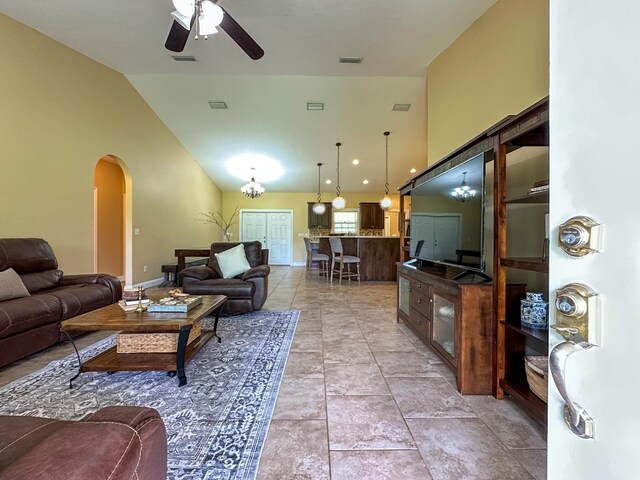 14135 98th St, Live Oak, FL 32060 - living area with arched walkways, ceiling fan, baseboards, and high vaulted ceiling