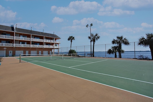 2289 Surf Rd Unit 12, Panacea, FL 32346 - view of tennis court with a water view and fence