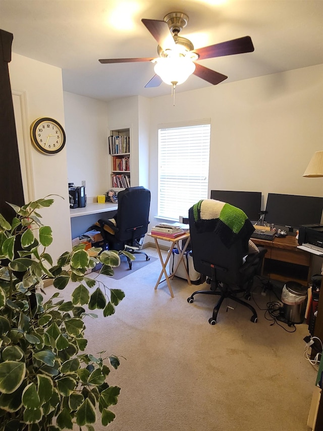 home office with light colored carpet and ceiling fan