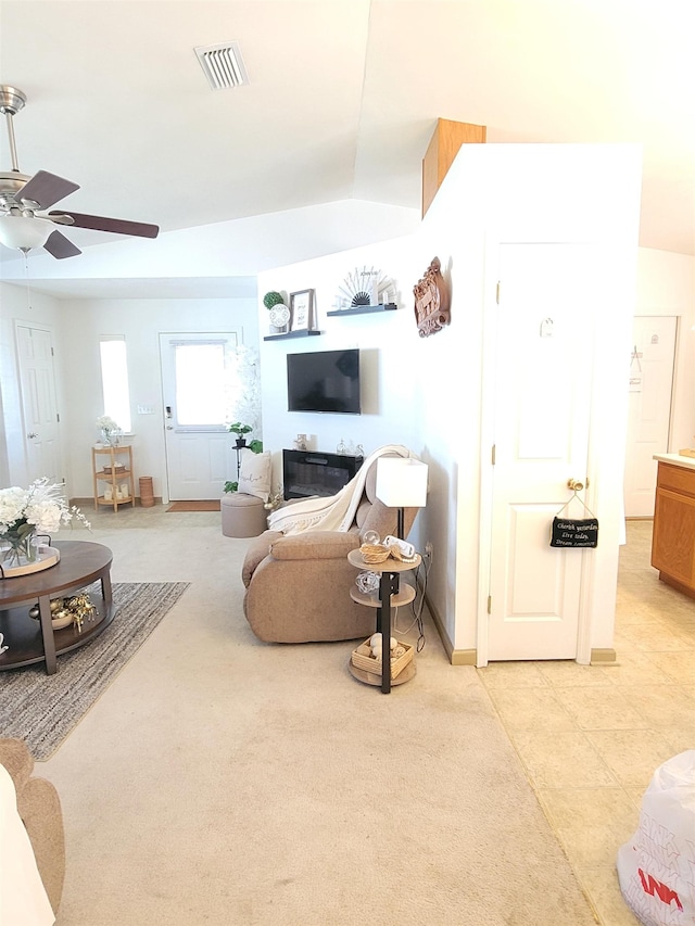 living room featuring lofted ceiling and ceiling fan