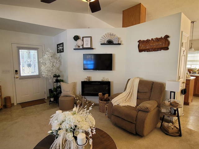 living room featuring ceiling fan and plenty of natural light