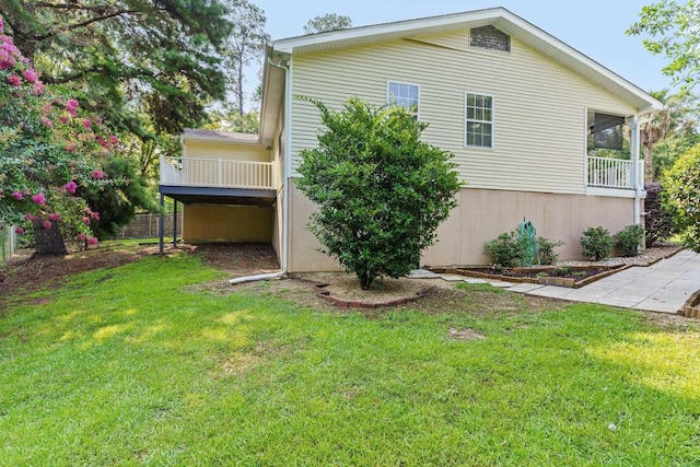 view of property exterior with a yard