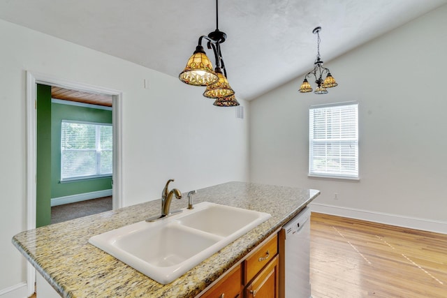 kitchen with dishwasher, lofted ceiling, a kitchen island with sink, sink, and hanging light fixtures