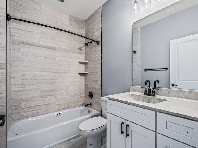 full bathroom with vanity, toilet, and tiled shower / bath