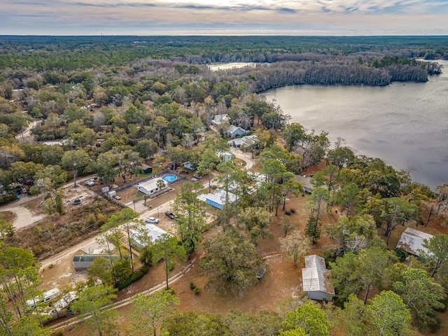 aerial view at dusk with a water view