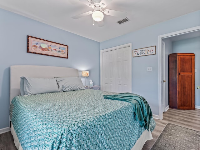 9 Pirates Cove Ln, Saint Marks, FL 32355 - bedroom with wood finished floors, a closet, and a ceiling fan