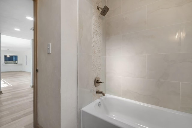 bathroom with bathing tub / shower combination