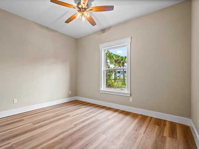 1673 Landing St, Carrabelle, FL 32322 - spare room featuring baseboards, light wood-type flooring, and a ceiling fan