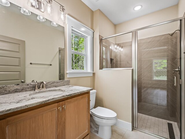 1673 Landing St, Carrabelle, FL 32322 - bathroom with toilet, vanity, a shower stall, and tile patterned flooring